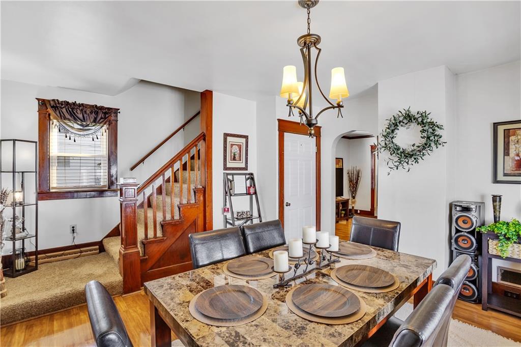 804 George Street Scottdale, PA 15683 - Photo 14 of 34 a view of a dining room with furniture a chandelier and wooden floor