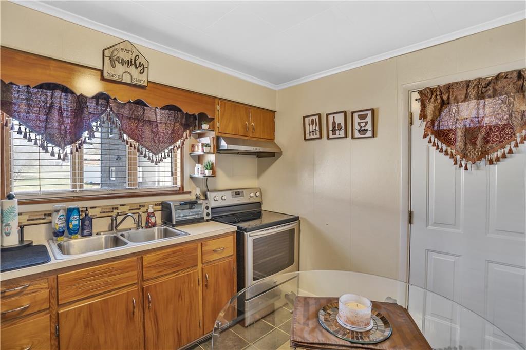 804 George Street Scottdale, PA 15683 - Photo 17 of 34 a kitchen with a sink and cabinets