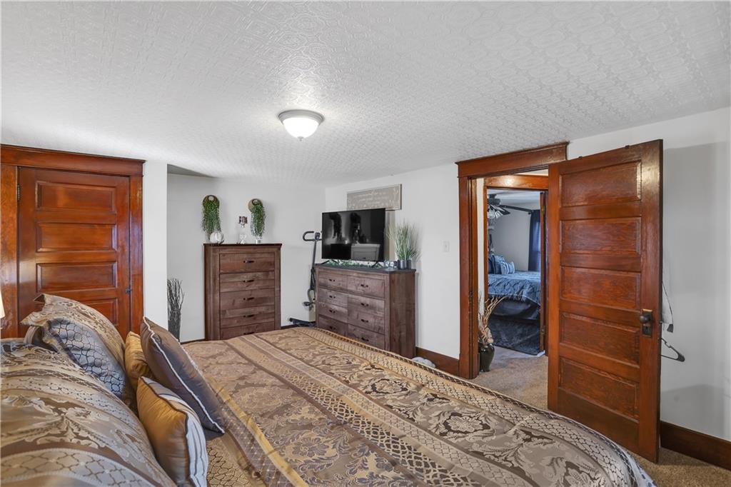 804 George Street Scottdale, PA 15683 - Photo 22 of 34 a bedroom with a bed and a television