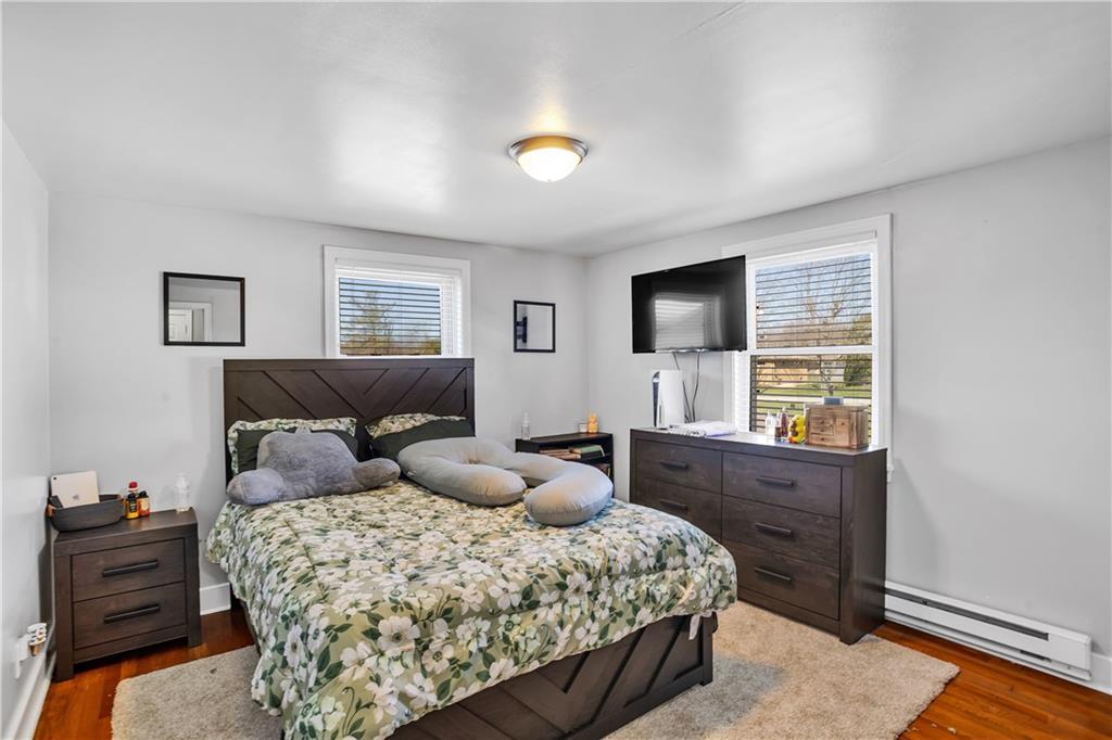 804 George Street Scottdale, PA 15683 - Photo 28 of 34 a bedroom with a bed and wooden floor