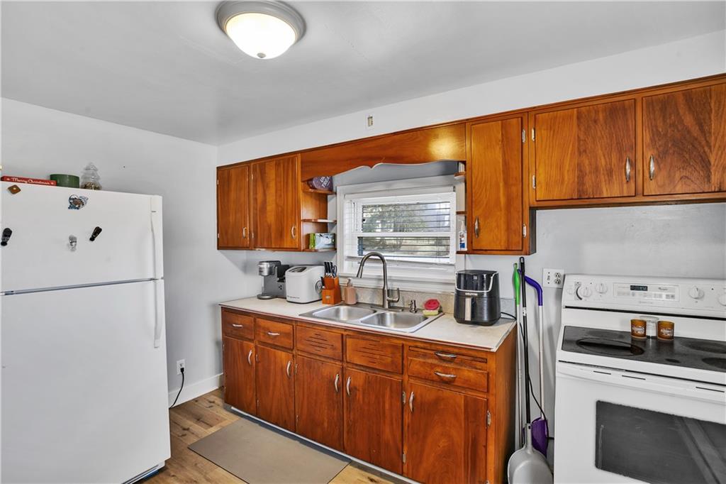 804 George Street Scottdale, PA 15683 - Photo 30 of 34 a kitchen with stainless steel appliances a refrigerator sink and cabinets