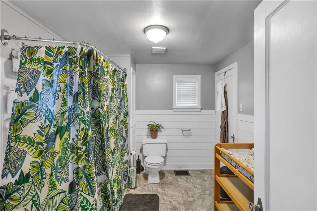 804 George Street Scottdale, PA 15683 - Photo 32 of 34 a bathroom with a sink a toilet and a mirror