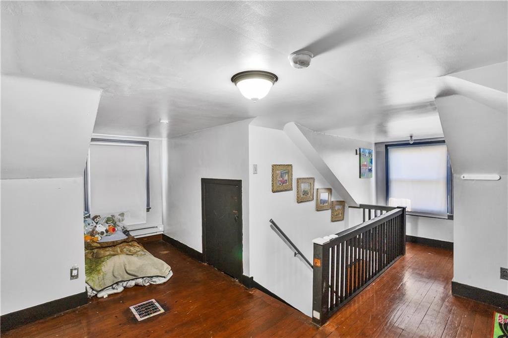 804 George Street Scottdale, PA 15683 - Photo 33 of 34 a room with wooden floor and stairs