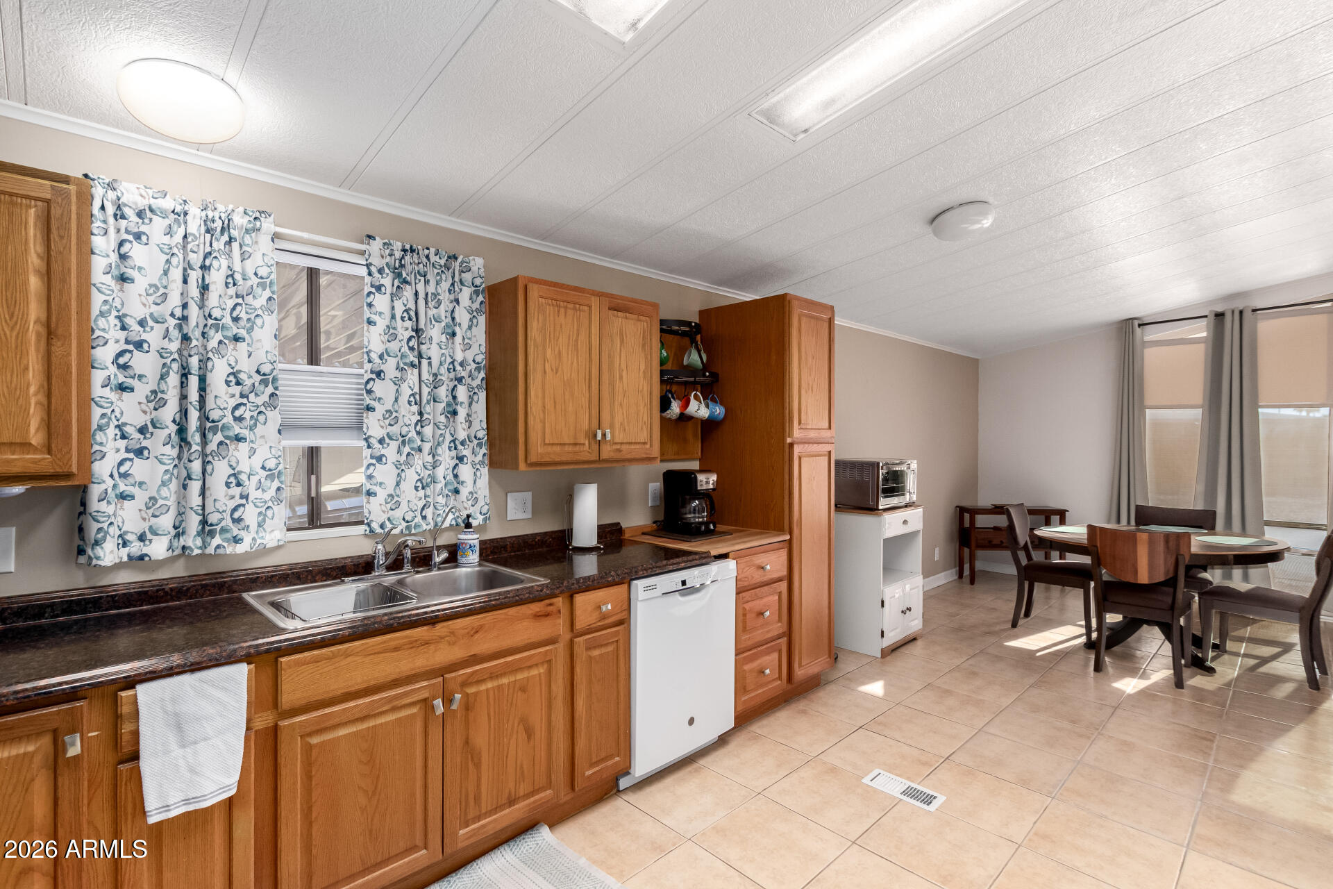 5402 East McKellips Road, Unit 186 Mesa, AZ 85215 - Photo 11 of 27 a kitchen with a sink and cabinets