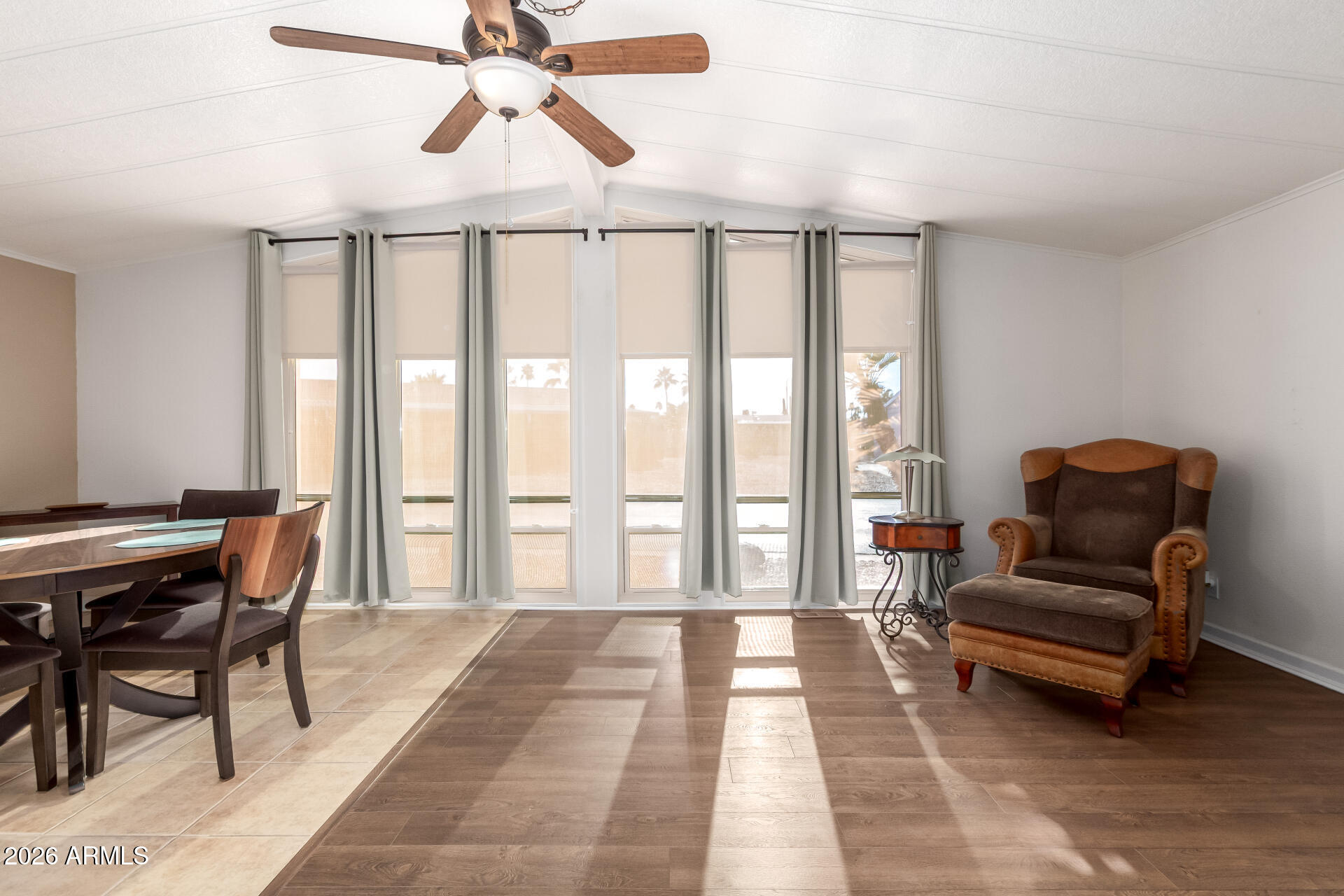 5402 East McKellips Road, Unit 186 Mesa, AZ 85215 - Photo 13 of 27 a living room with furniture and a floor to ceiling window