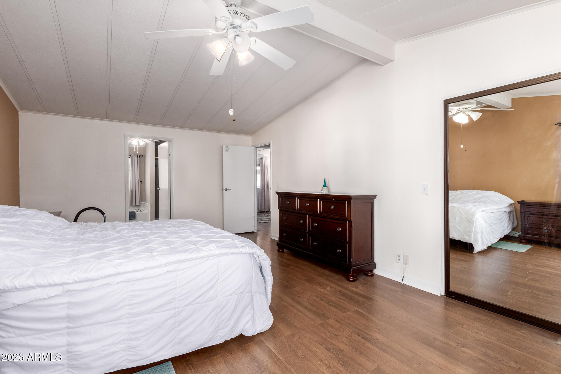 5402 East McKellips Road, Unit 186 Mesa, AZ 85215 - Photo 17 of 27 a bedroom with a bed and a chandelier