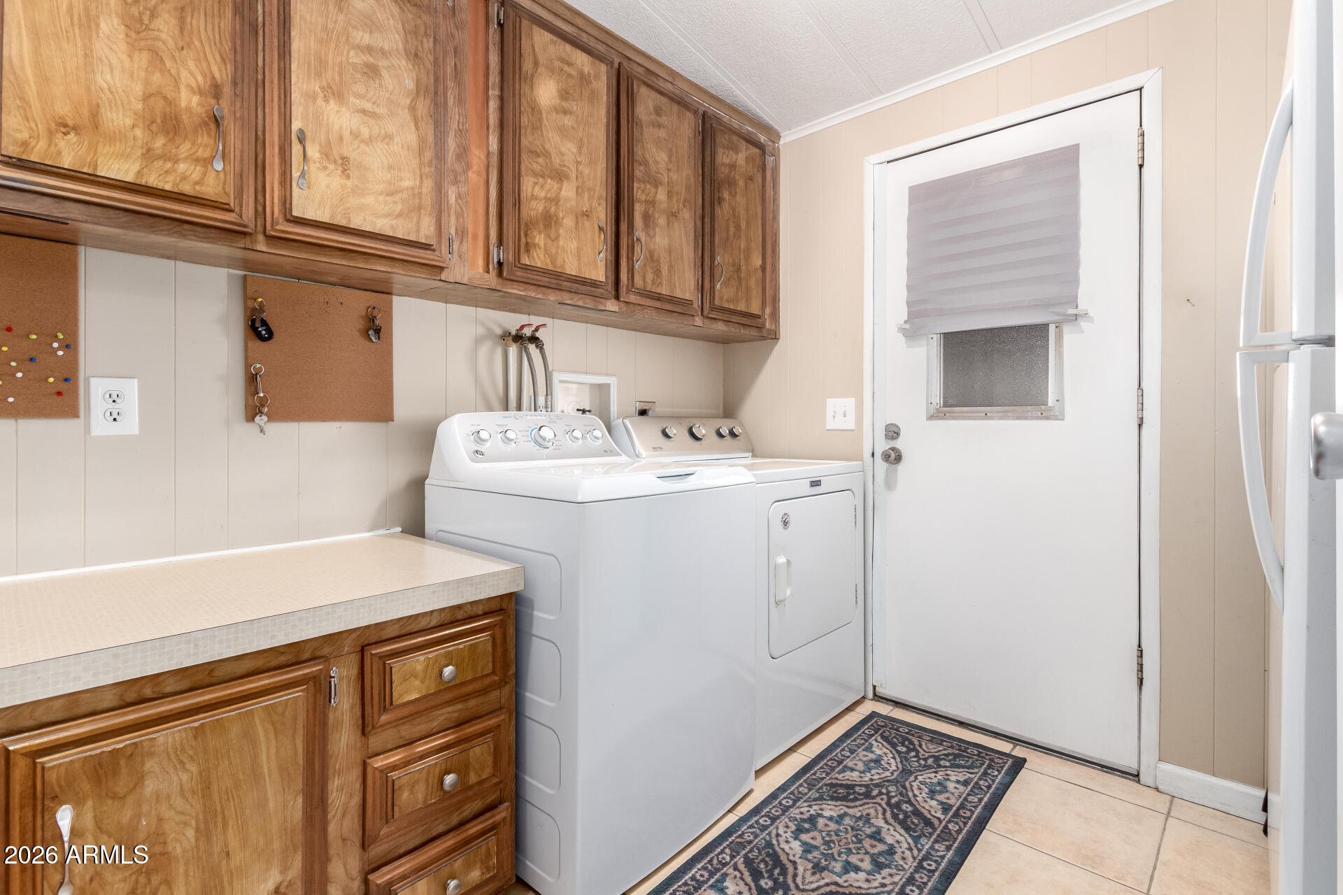 5402 East McKellips Road, Unit 186 Mesa, AZ 85215 - Photo 24 of 27 a utility room with dryer and washer