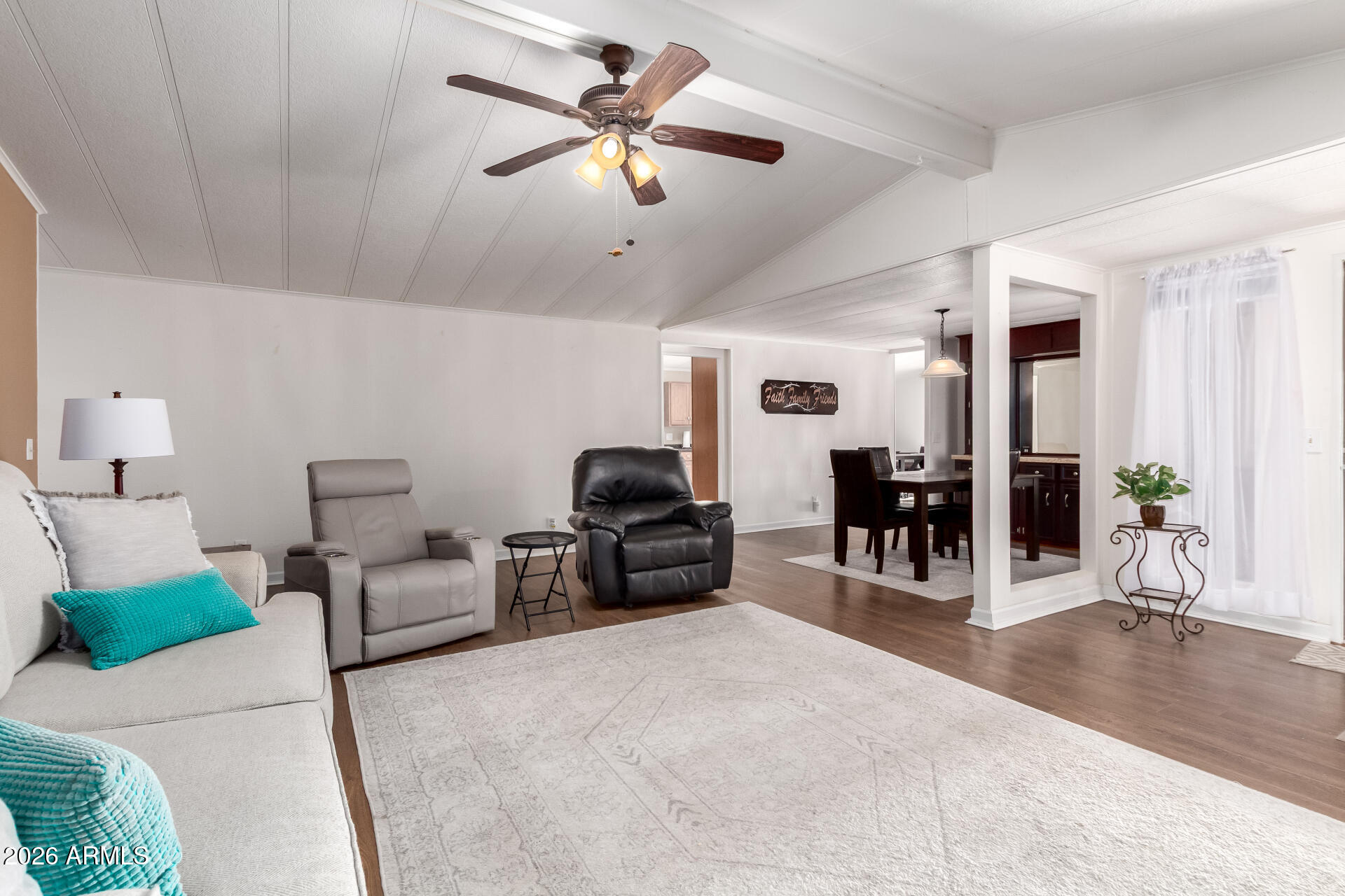 5402 East McKellips Road, Unit 186 Mesa, AZ 85215 - Photo 5 of 27 a living room with furniture and wooden floor