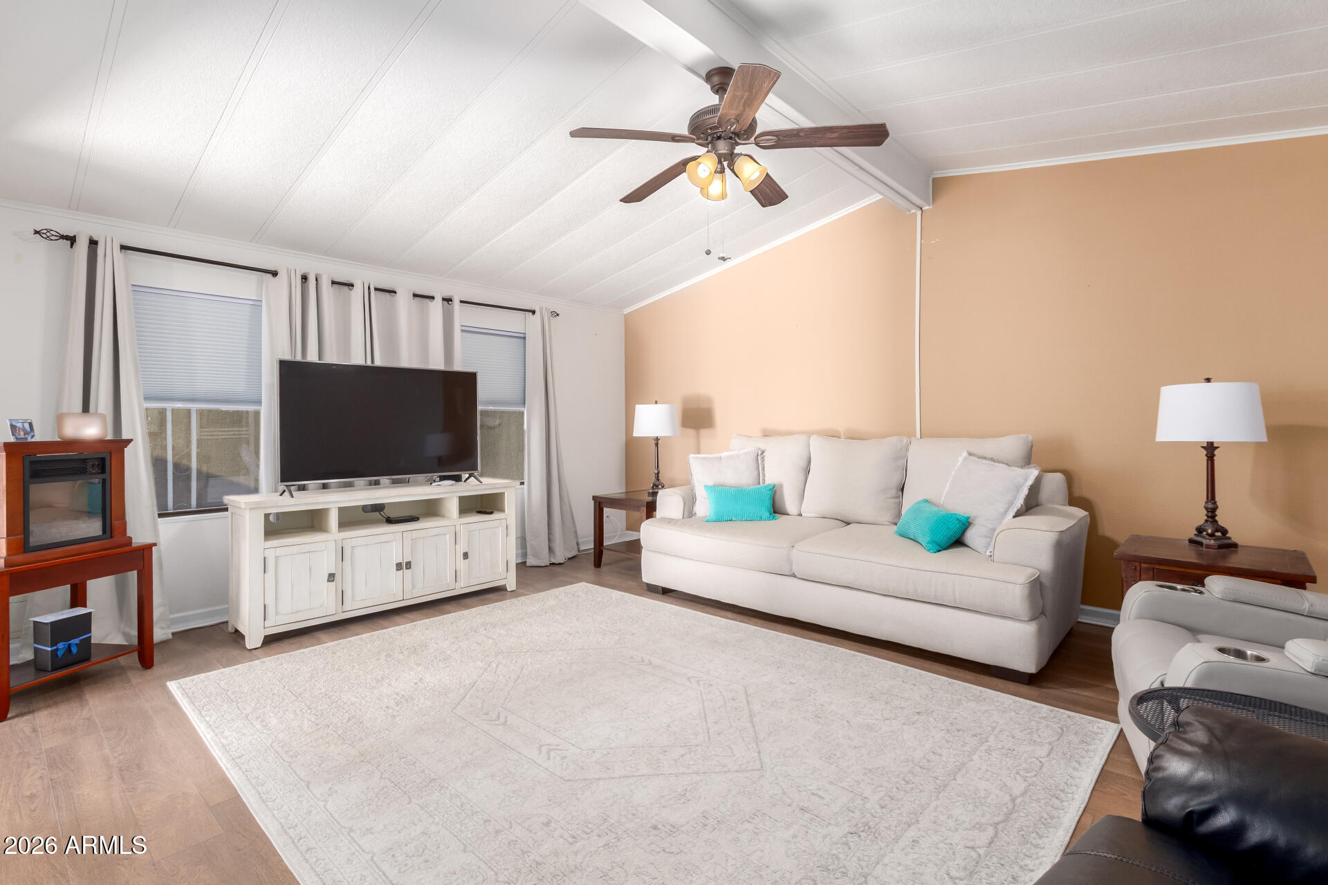 5402 East McKellips Road, Unit 186 Mesa, AZ 85215 - Photo 6 of 27 a living room with furniture and a flat screen tv