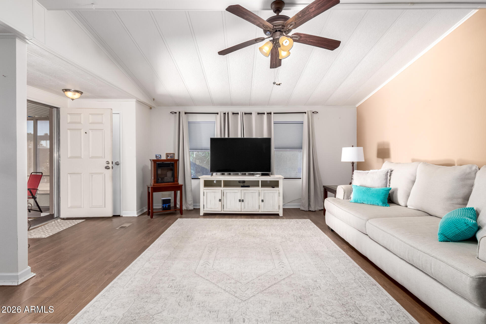 5402 East McKellips Road, Unit 186 Mesa, AZ 85215 - Photo 7 of 27 a living room with furniture and a flat screen tv