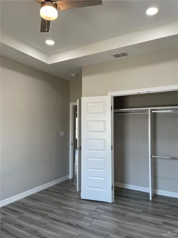 a bathroom with a sink toilet vanity and shower