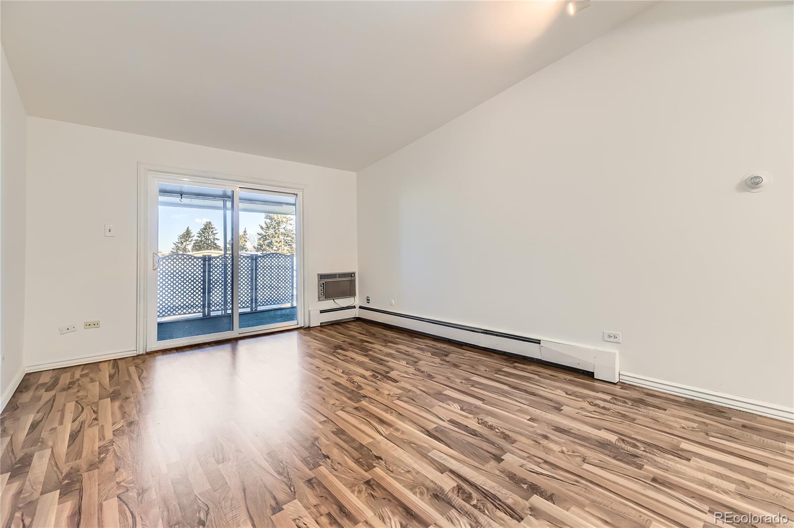 735 South Clinton Street, Unit 5B Denver, CO 80247 - Photo 15 of 15 wooden floor in an empty room