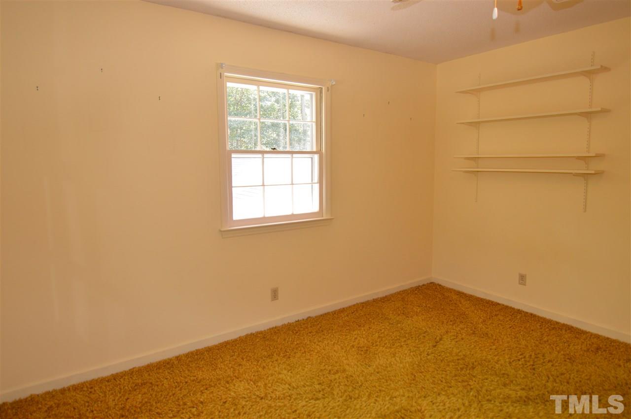 112 Bayleaf Drive Raleigh, NC 27615 - Photo 12 of 25 Hardwood floors are under this lovely shag carpet