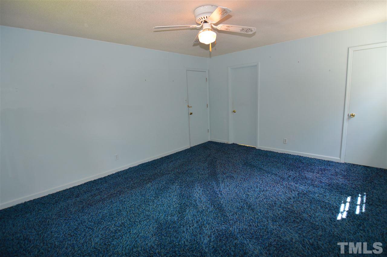 112 Bayleaf Drive Raleigh, NC 27615 - Photo 14 of 25 Has a walk in closet and a large master bath area that could easily be renovated into a modern bath