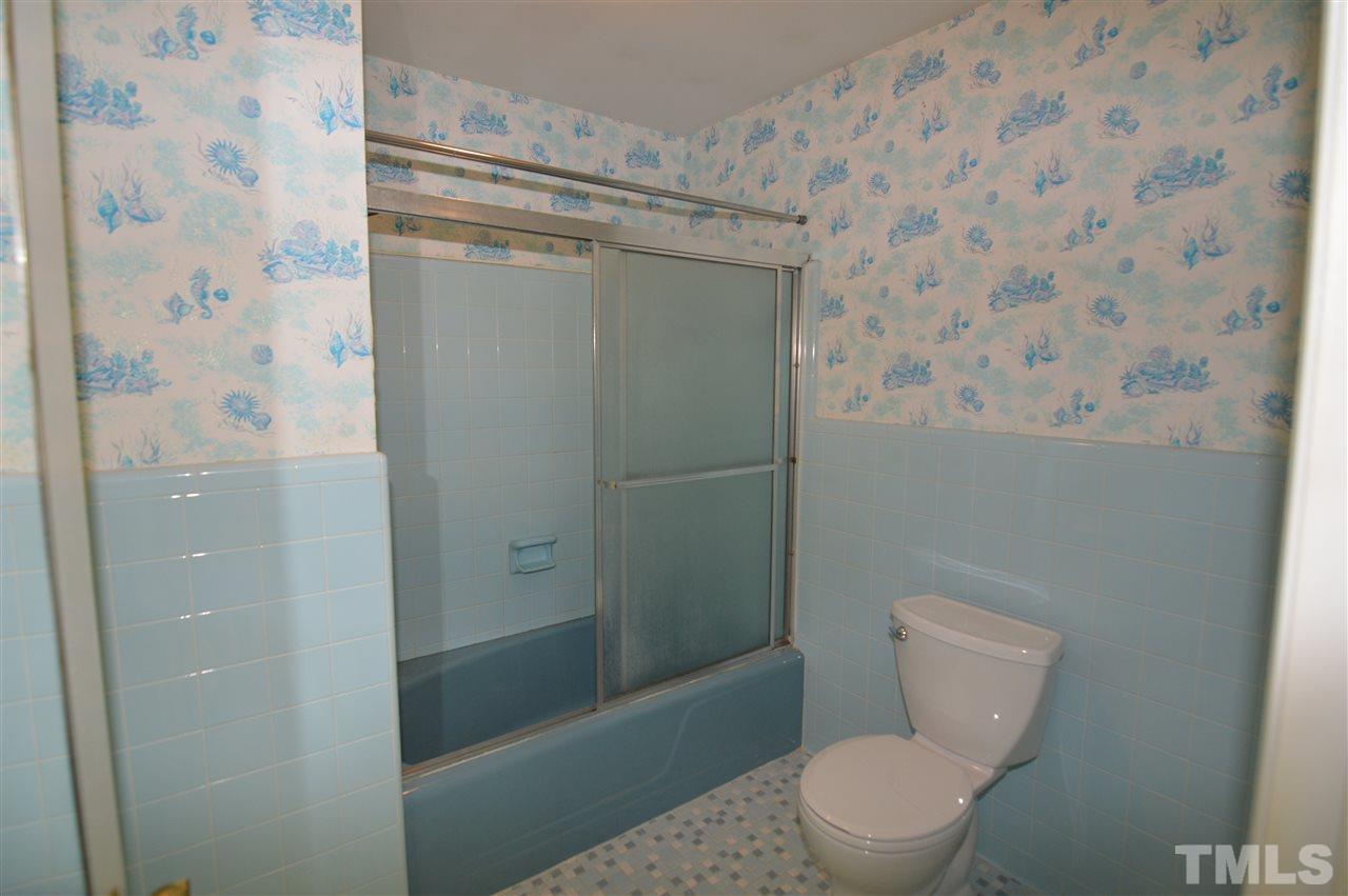 112 Bayleaf Drive Raleigh, NC 27615 - Photo 16 of 25 Bath/Shower and toilet area, easily renovated to a spacious master bath spa.