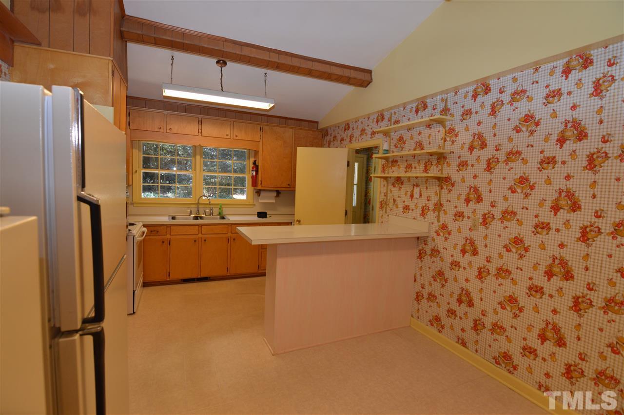 112 Bayleaf Drive Raleigh, NC 27615 - Photo 8 of 25 The kitchen cabinets are solid wood