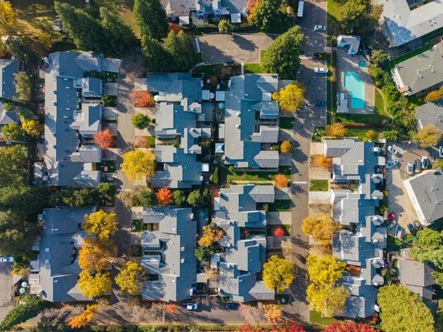 an aerial view of a house with a swimming pool