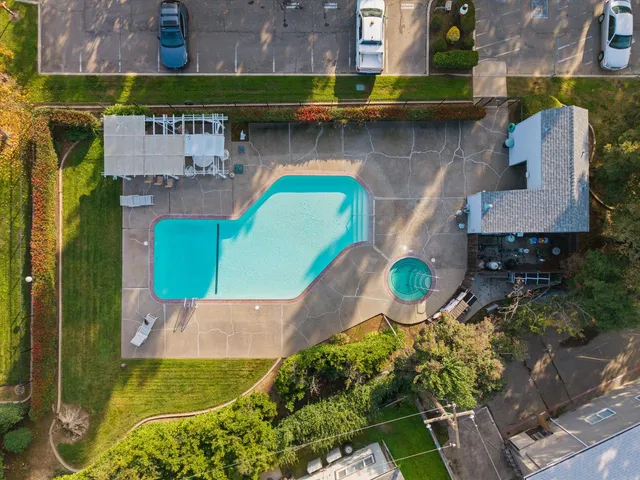 an aerial view of residential houses with outdoor space