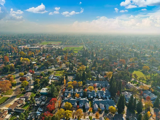 an aerial view of residential houses with outdoor space