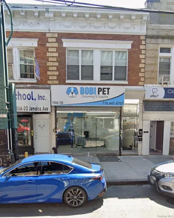 a front view of building with white umbrellas