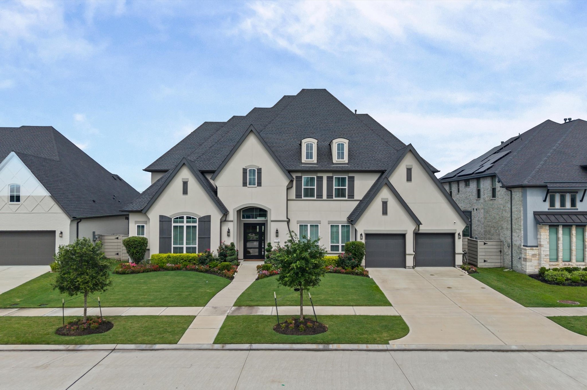 4923 Grapevine Lane Manvel, TX 77578 - Photo 2 of 49 a front view of a house with a yard