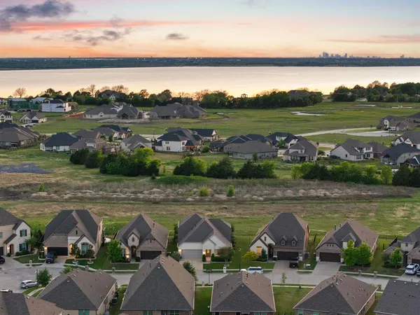 an aerial view of a house with big yard