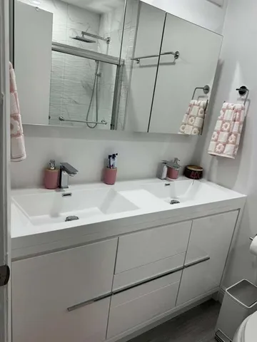 a bathroom with a shower and a toilet