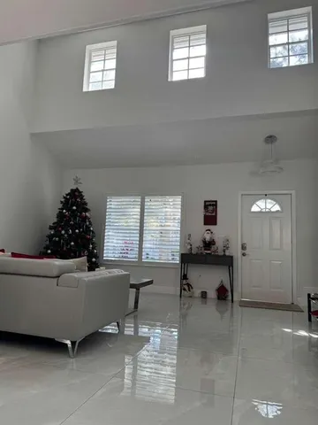 a living room with furniture and window