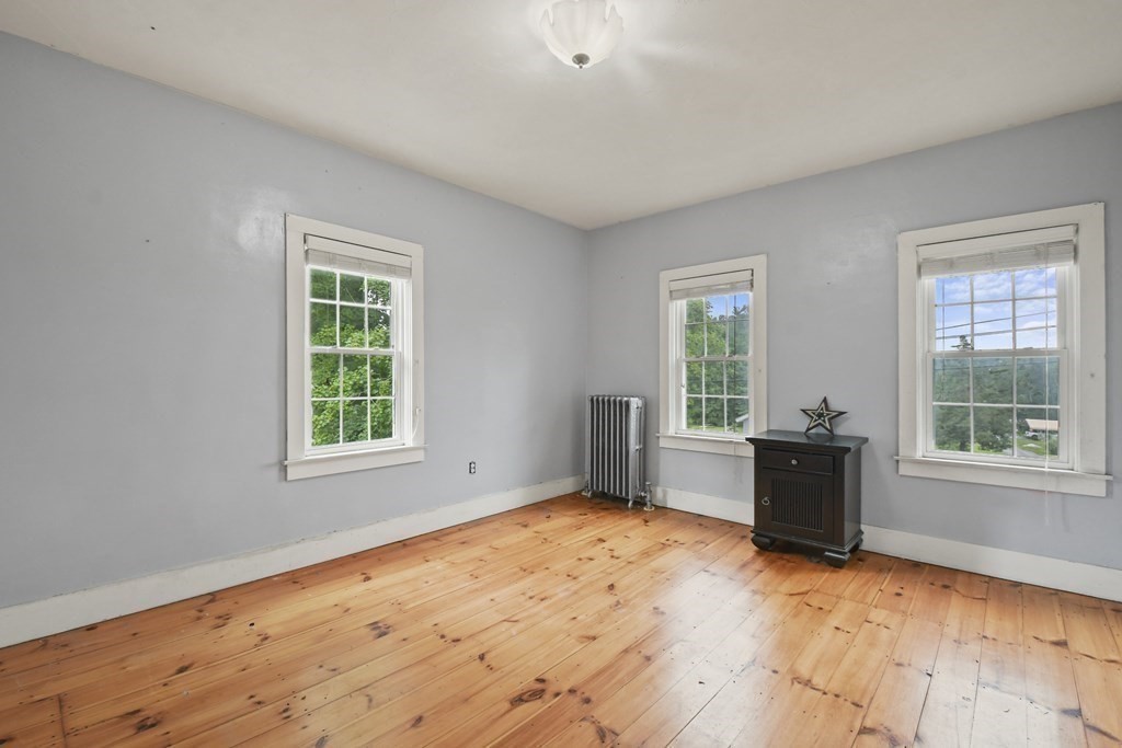 235 Manchaug Road Sutton, MA 01590 - Photo 23 of 41 a view of an empty room with a window