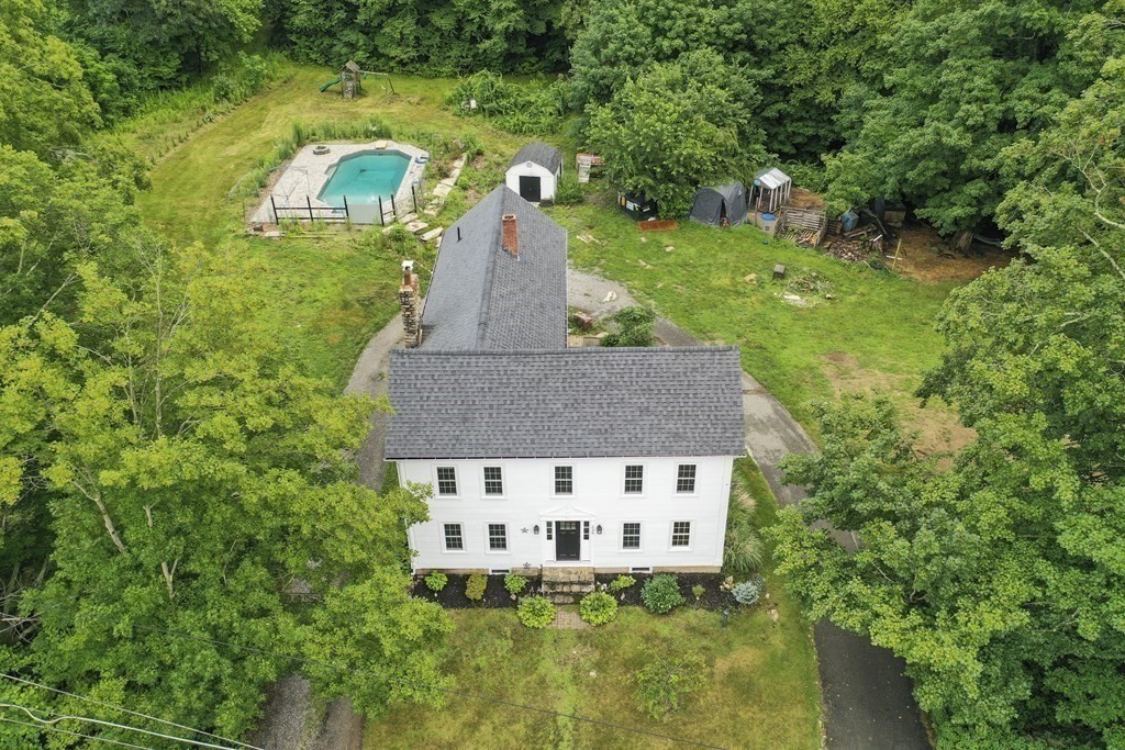 235 Manchaug Road Sutton, MA 01590 - Photo 33 of 41 a view of a house with a yard