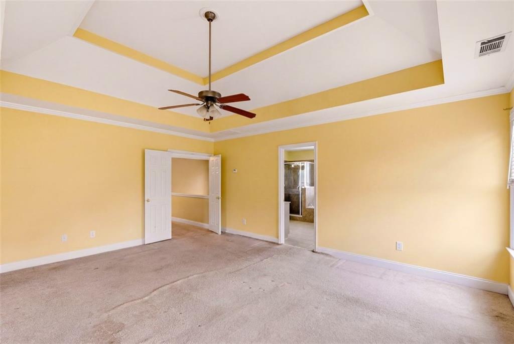 3420 Bulloch Lake Road Loganville, GA 30052 - Photo 33 of 57 a view of an empty room with a ceiling fan