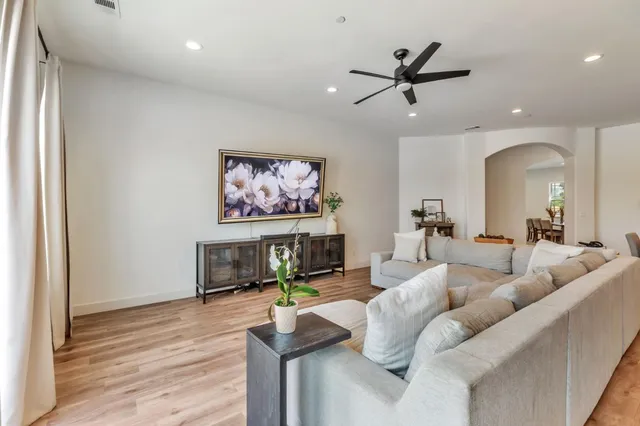 a dining room with furniture and wooden floor