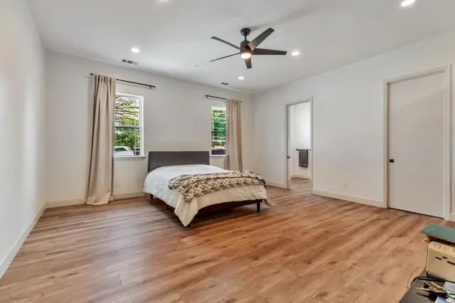 a bathroom with a sink toilet and a mirror