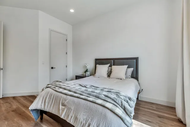 a spacious bathroom with a shower sink and a mirror