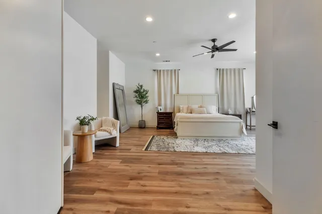 a front view of a building with trees