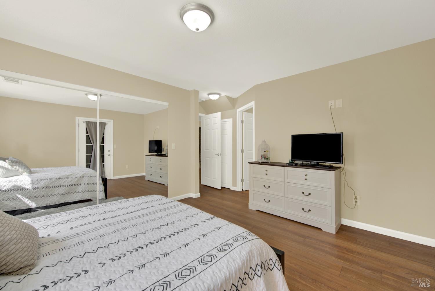 4851 Udell Road Vacaville, CA 95688 - Photo 21 of 65 a bedroom with a bed and flat screen tv