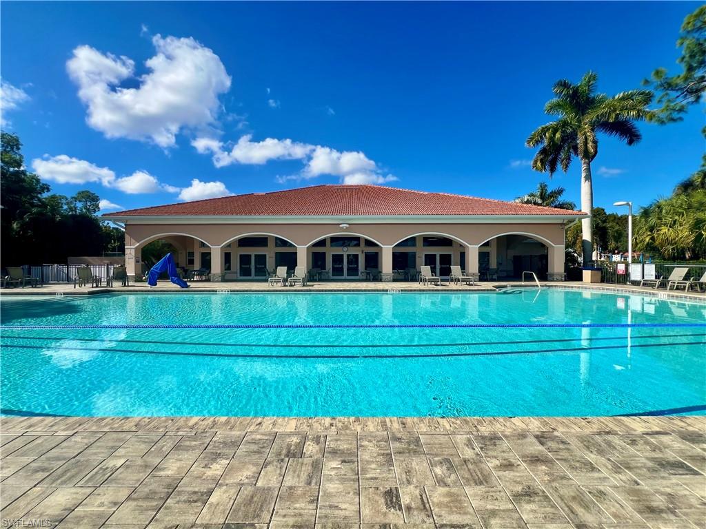 7809 Stratford Drive Naples, FL 34104 - Photo 28 of 47 a front view of a house with a garden and entertaining space