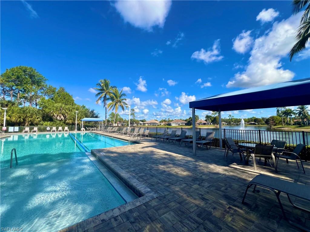 7809 Stratford Drive Naples, FL 34104 - Photo 29 of 47 a view of a swimming pool with a patio