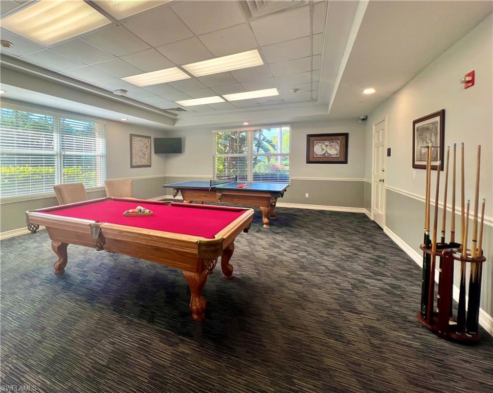 7809 Stratford Drive Naples, FL 34104 - Photo 36 of 47 a room with pool table windows and wooden floor