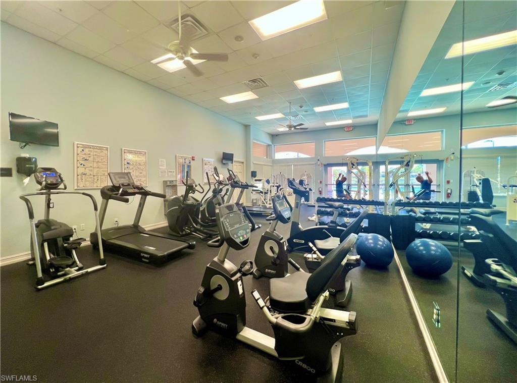 7809 Stratford Drive Naples, FL 34104 - Photo 37 of 47 a gym room with lots of gym equipment