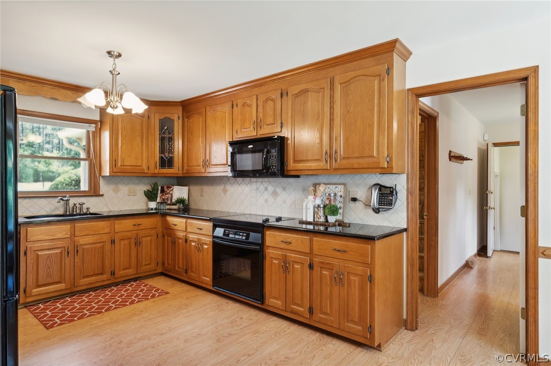 13200 River Road Chesterfield, VA 23838 - Photo 14 of 50 a kitchen with stainless steel appliances granite countertop wooden cabinets a sink a stove a refrigerator and island with wooden floor