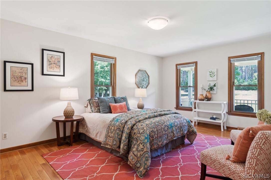 13200 River Road Chesterfield, VA 23838 - Photo 28 of 50 a bedroom with a bed and wooden floor