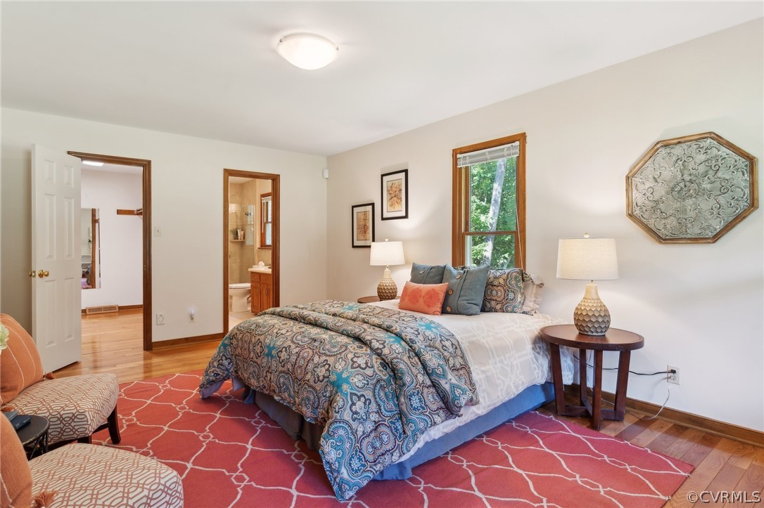 13200 River Road Chesterfield, VA 23838 - Photo 29 of 50 a bedroom with a bed and wooden floor