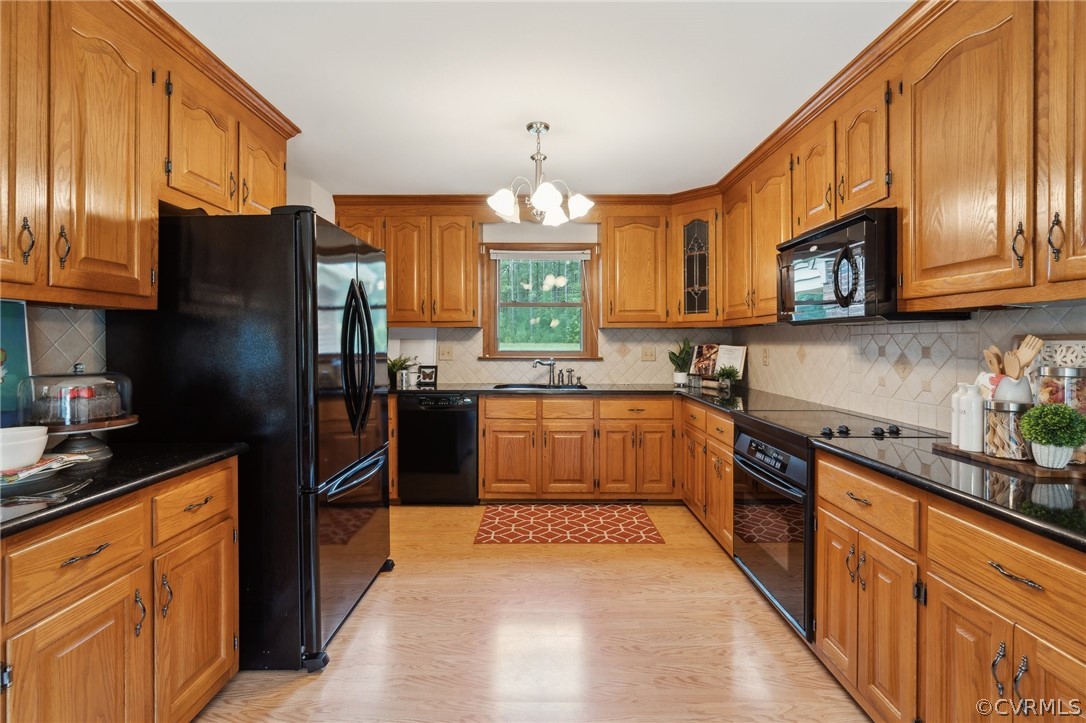13200 River Road Chesterfield, VA 23838 - Photo 10 of 50 a kitchen with stainless steel appliances granite countertop a refrigerator a sink dishwasher a oven with wooden cabinets and a stove