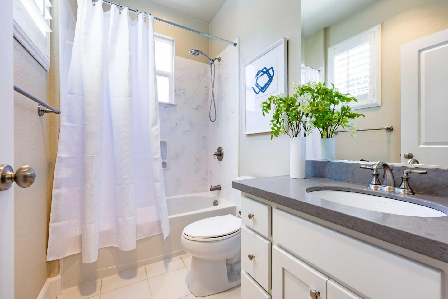 1400 Marigold Court Mountain View, CA 94040 - Photo 16 of 24 a bathroom with a granite countertop sink a toilet and shower