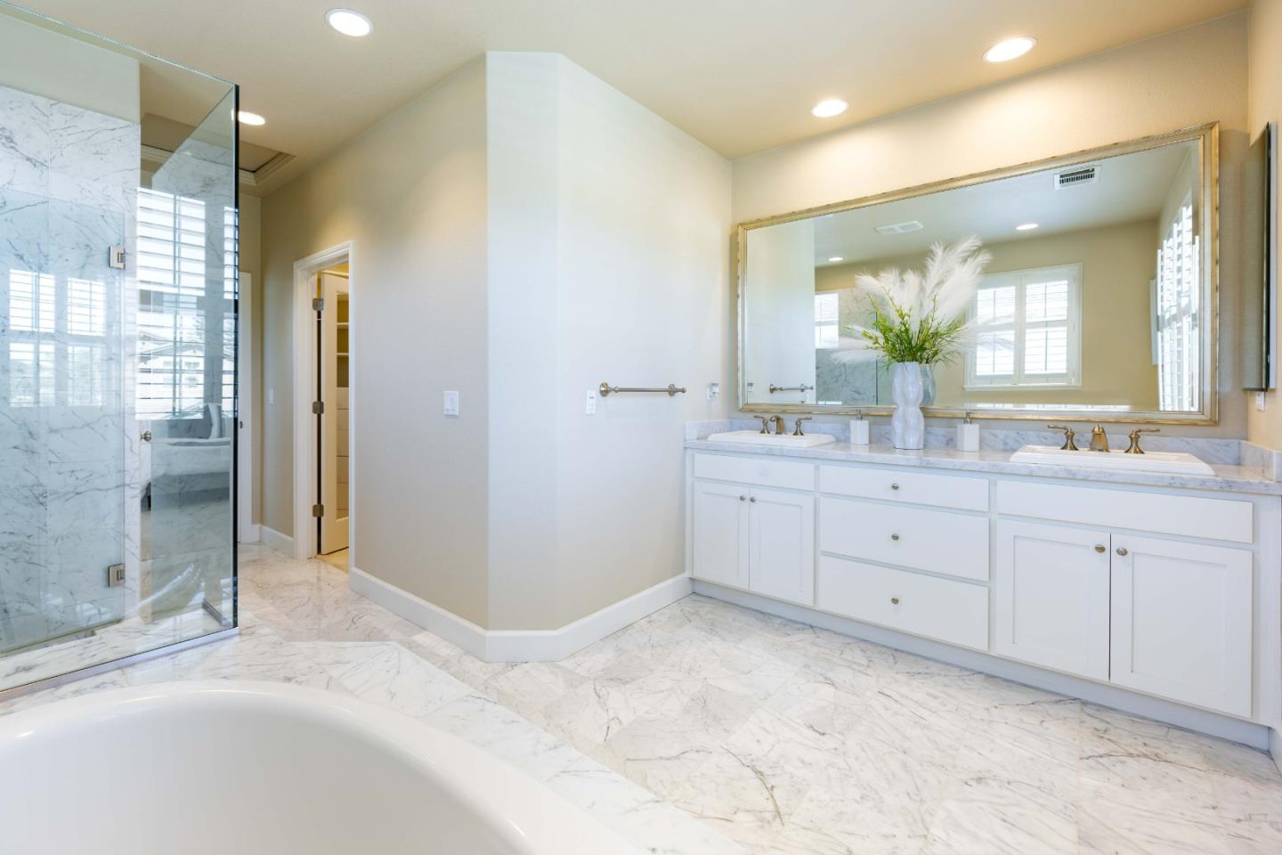 1400 Marigold Court Mountain View, CA 94040 - Photo 18 of 24 a spacious bathroom with a shower sink and mirror