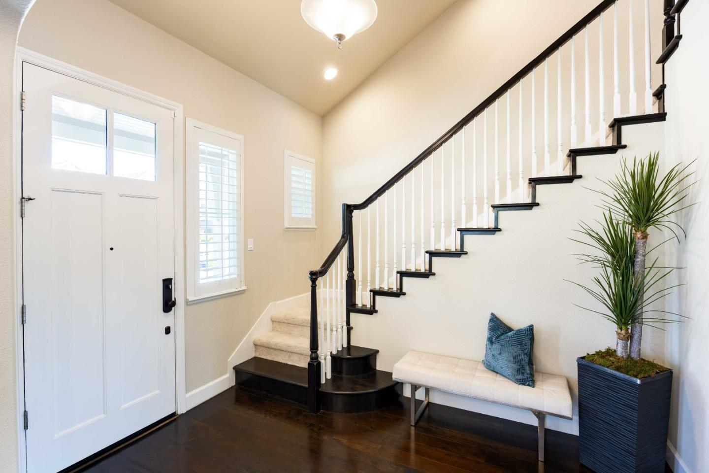 1400 Marigold Court Mountain View, CA 94040 - Photo 3 of 24 a view of entryway with wooden floor and stairs
