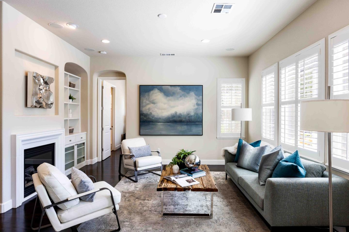 1400 Marigold Court Mountain View, CA 94040 - Photo 9 of 24 a living room with furniture flat screen tv and a fireplace