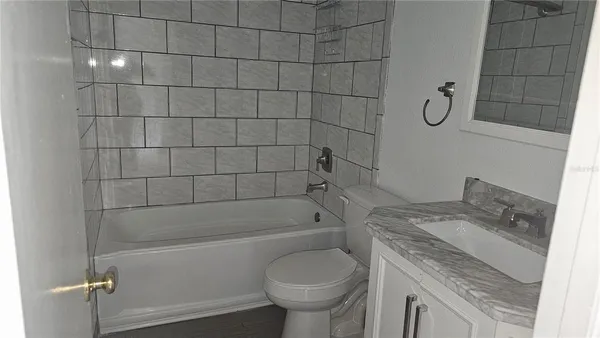 an empty room with an entrance to other room