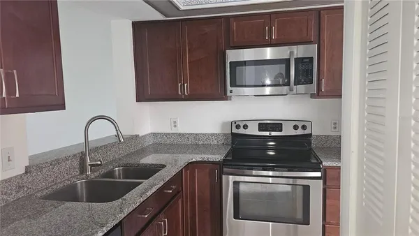 a kitchen with a stove and a microwave